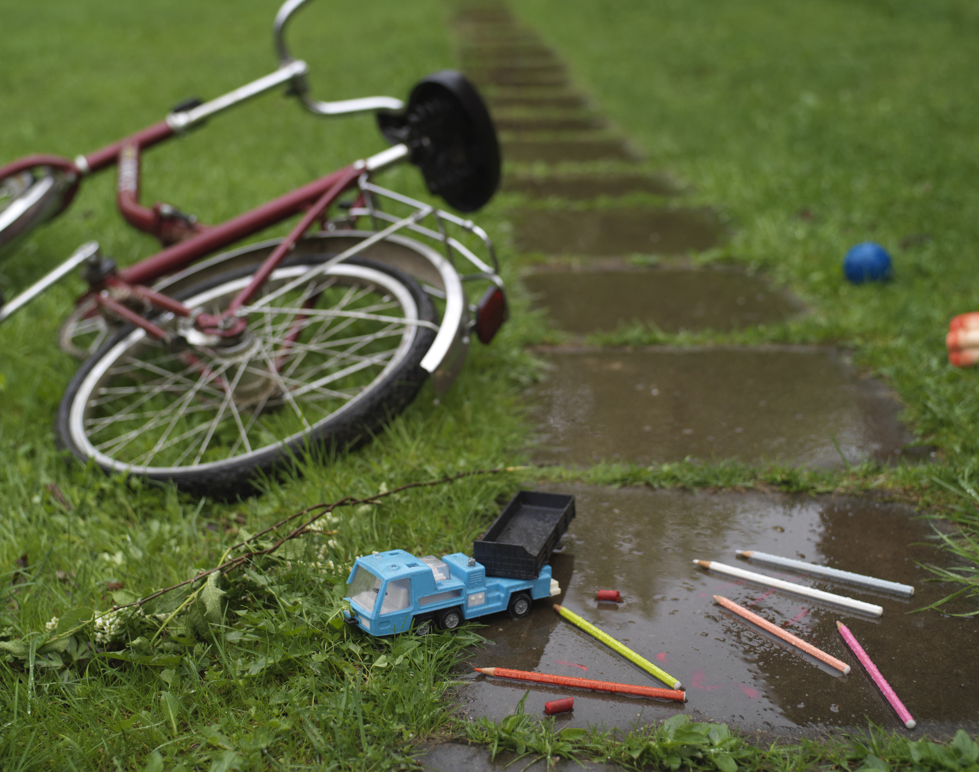 Toys and bikes left on the floor and should be tidied up when getting ready to sell your home in the summer