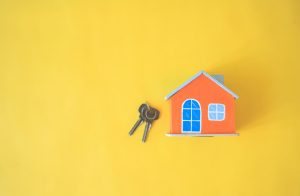 house on a yellow background and a set of keys